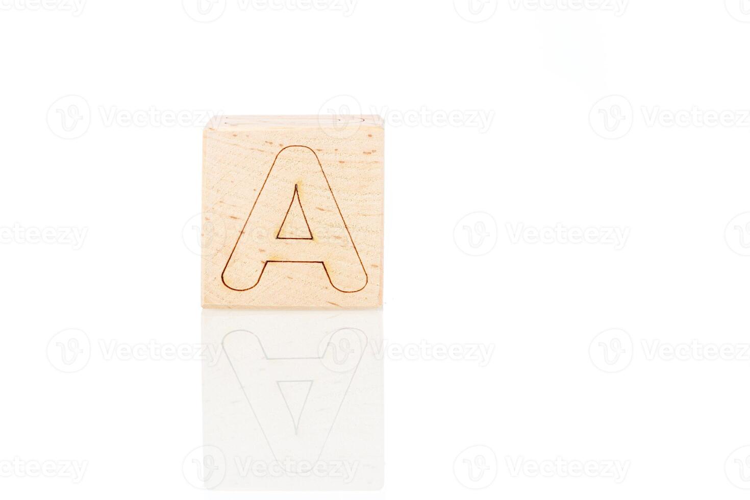 Wooden cubes with letters on a white background photo