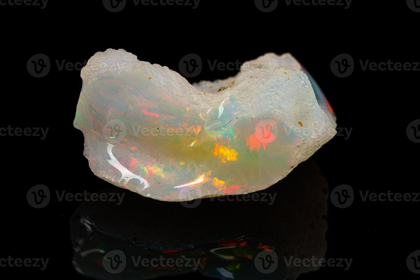 macro mineral stone rare and beautiful opals on a black background photo