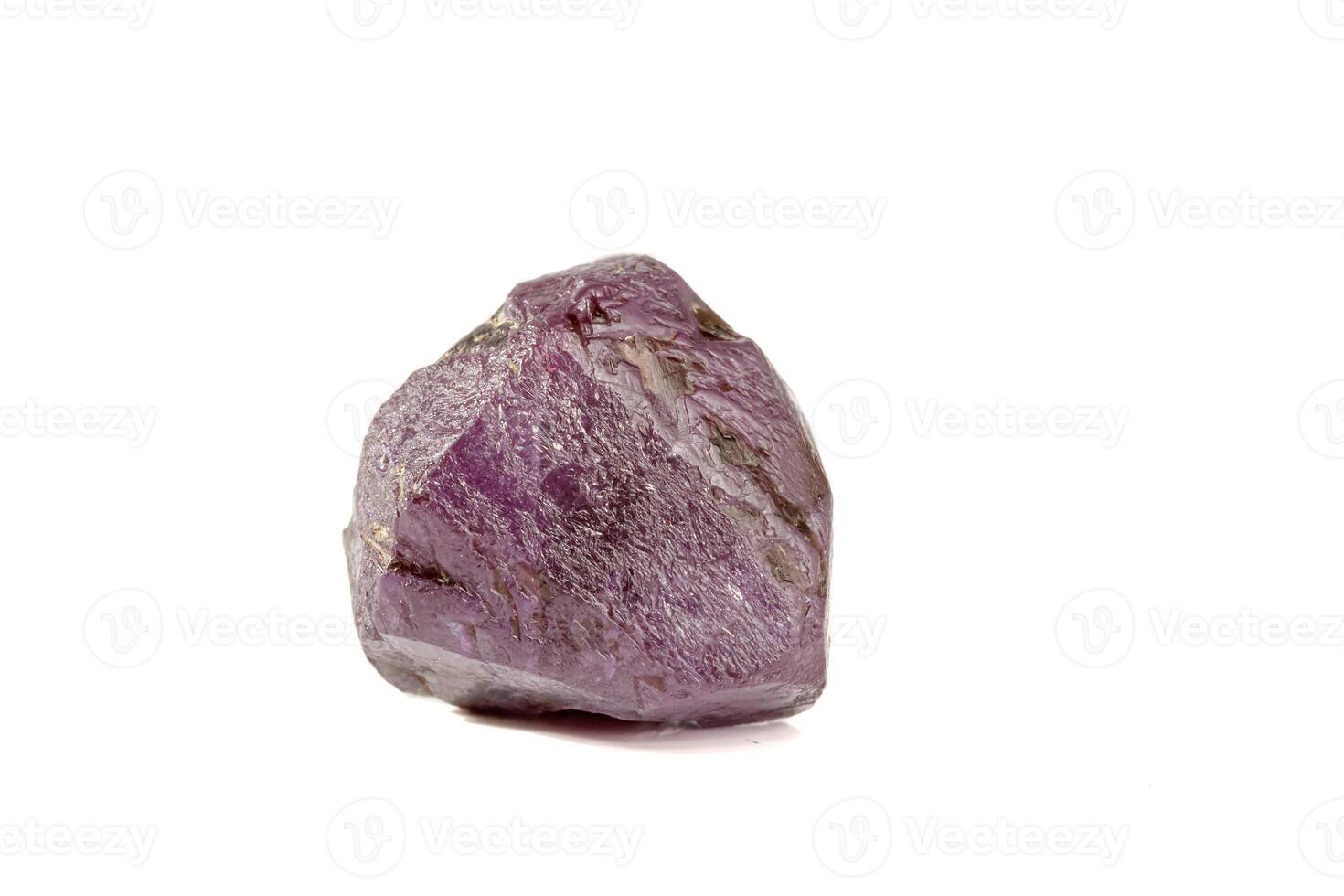 macro mineral stone alexandrite red - violet in daylight on a white photo