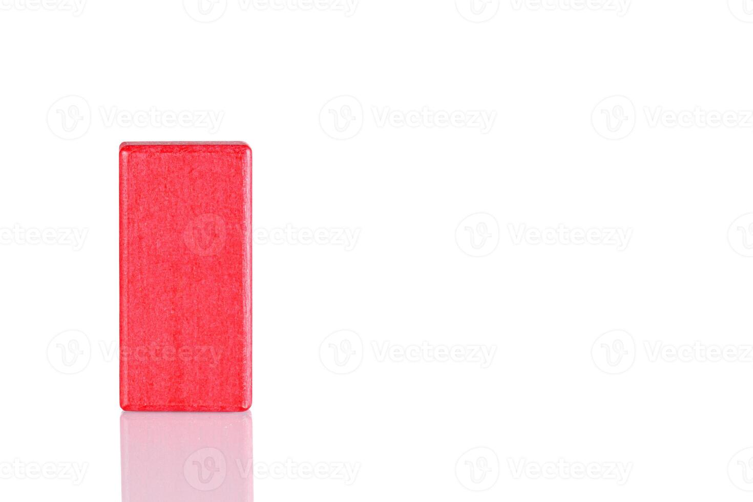 Wooden cube of red color on a white background photo