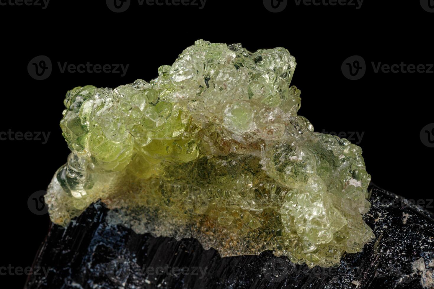 Macro stone Hyalite mineral, tourmaline Sherl, smoky quartz on a black background photo
