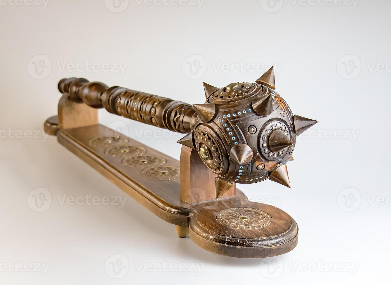 Souvenir wooden Hetman's Mace on a stand on a white background. Ukraine. photo
