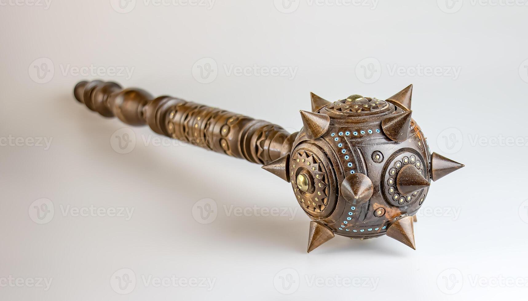 Souvenir wooden Hetman's Mace on a stand on a white background. Ukraine. photo