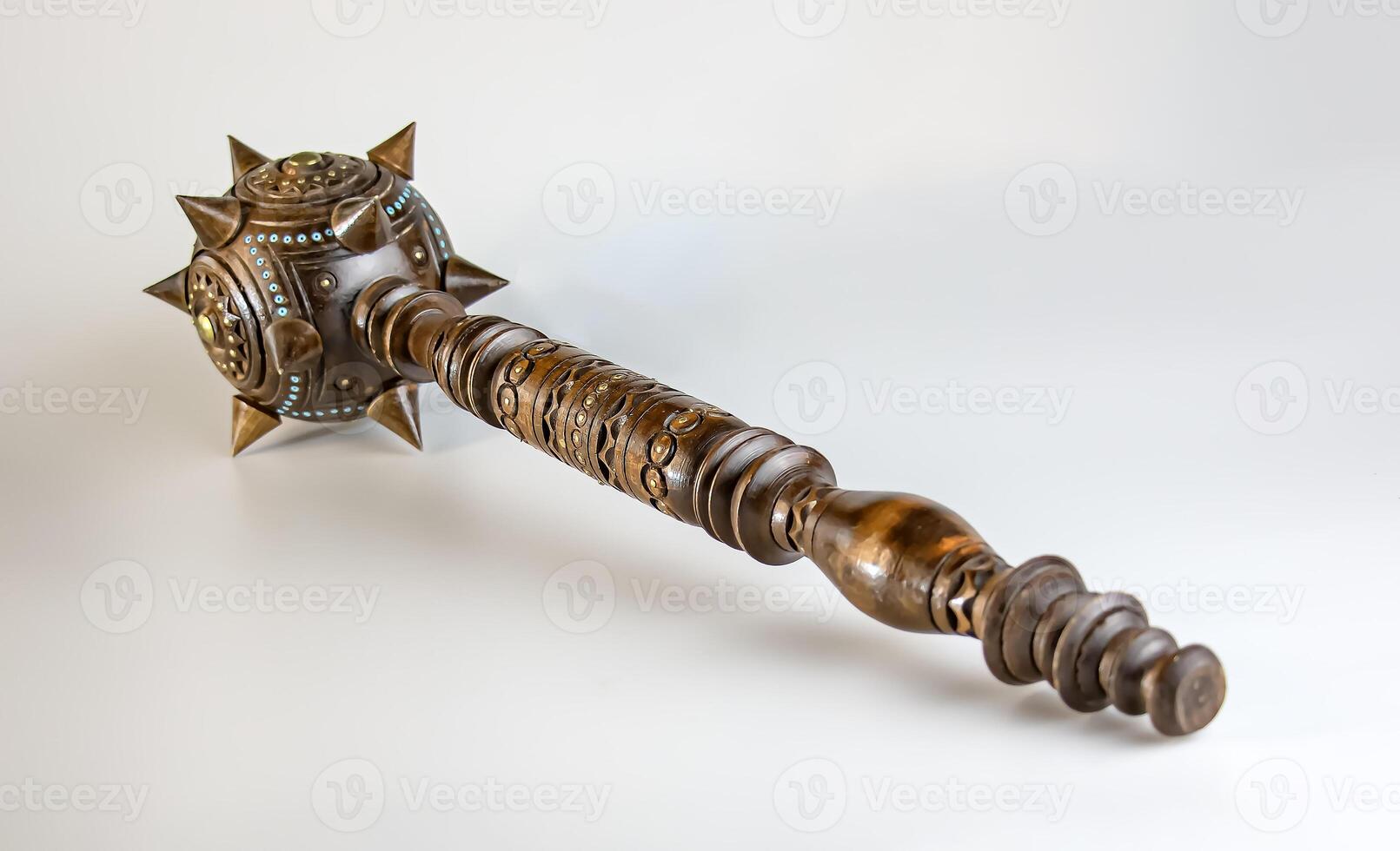 Souvenir wooden Hetman's Mace on a stand on a white background. Ukraine. photo