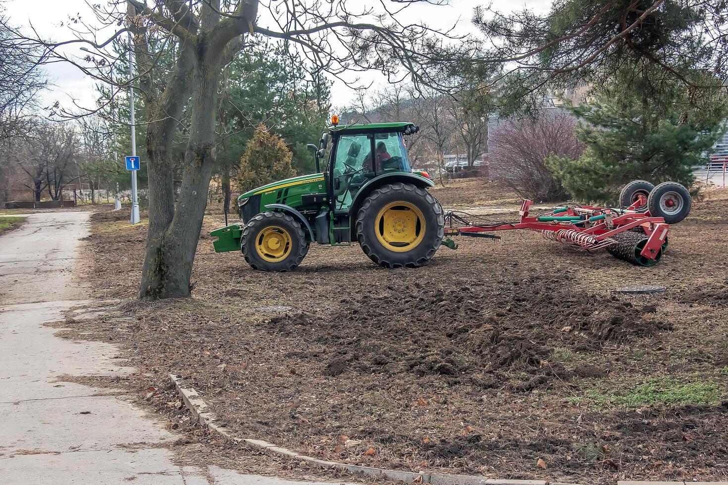 Nitra, Slovakia - 01.16.2024 A tractor harrows the soil in a field. photo