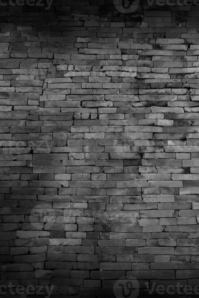 Black brick walls that are not plastered background and texture. The texture of the brick is black. Background of empty brick basement wall. photo