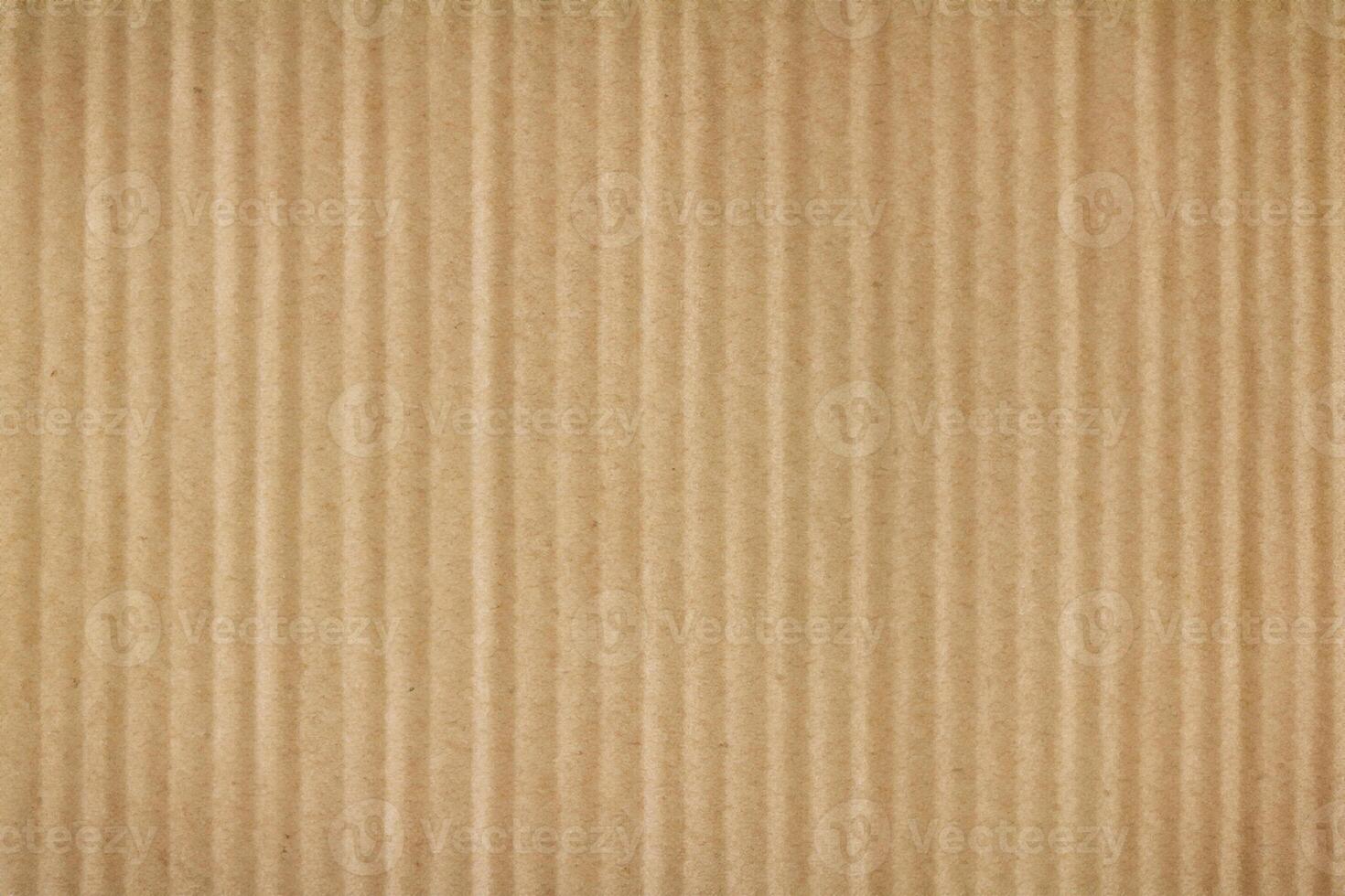 A background with a texture of brown cardboard up close. photo
