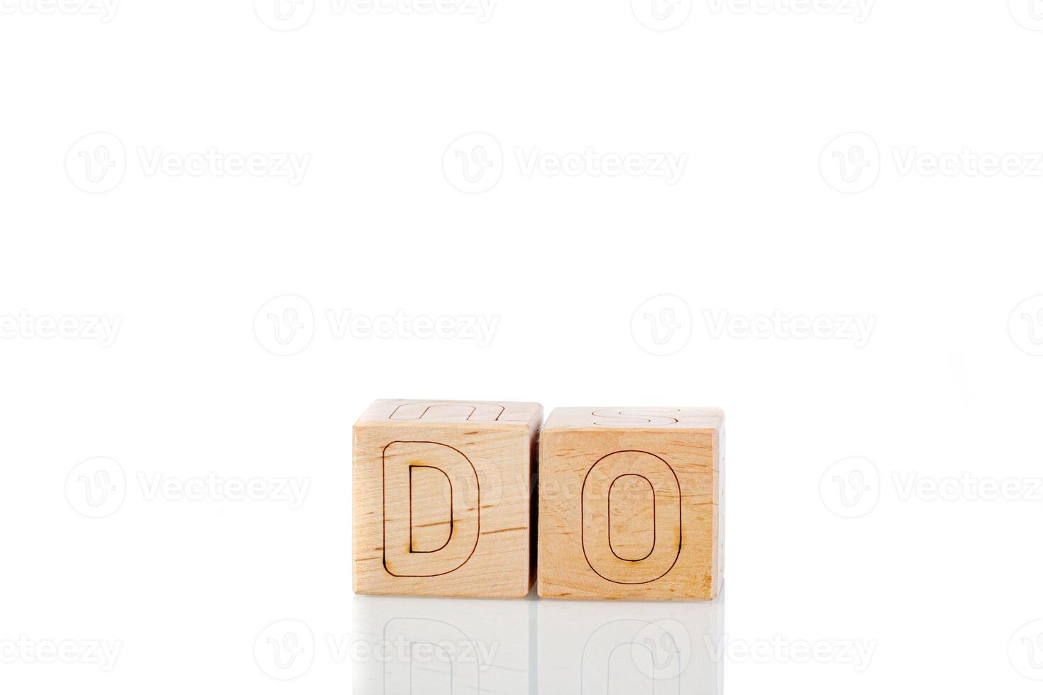 Wooden cubes with letters do on a white background photo