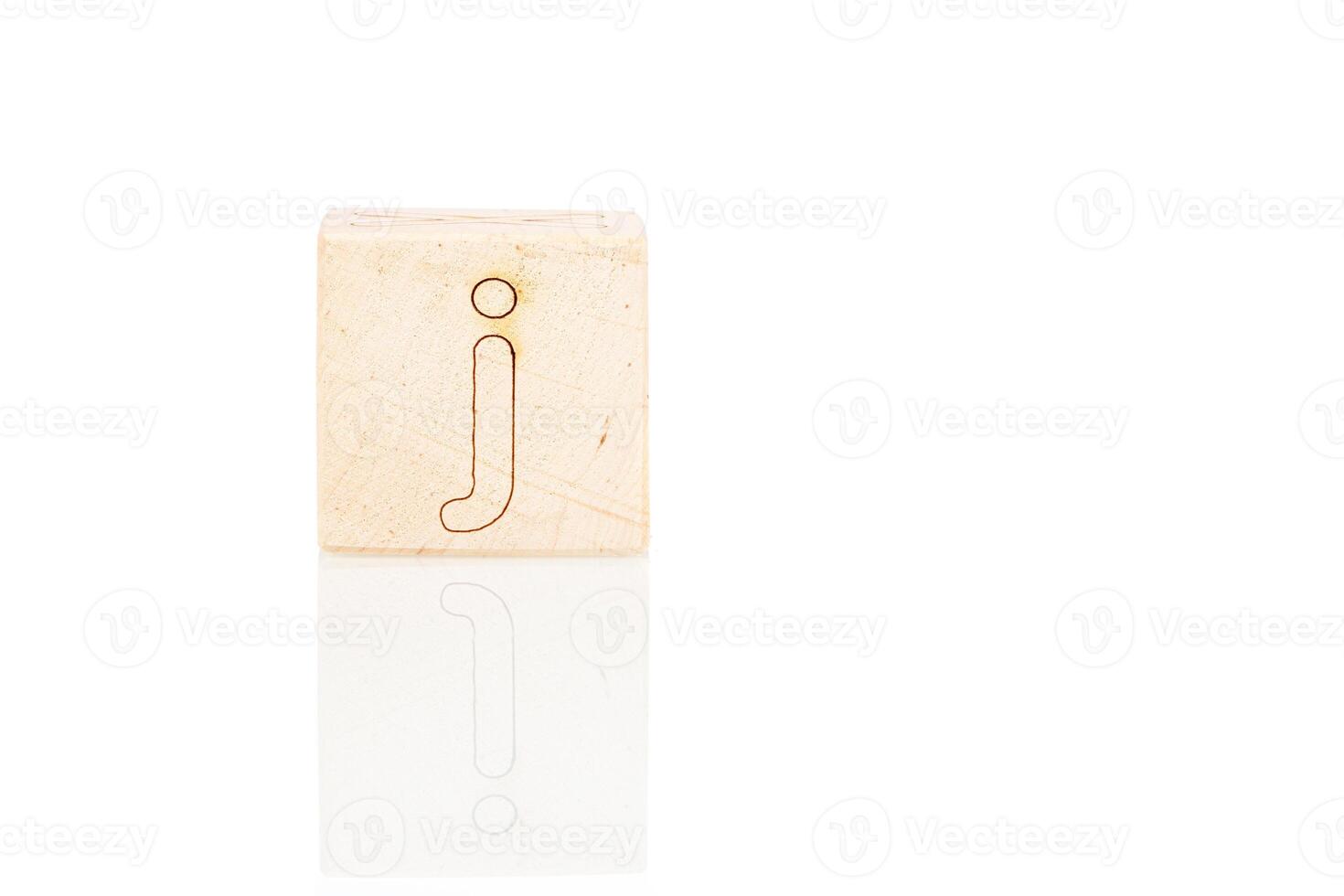 Wooden cubes with letters J on a white background photo
