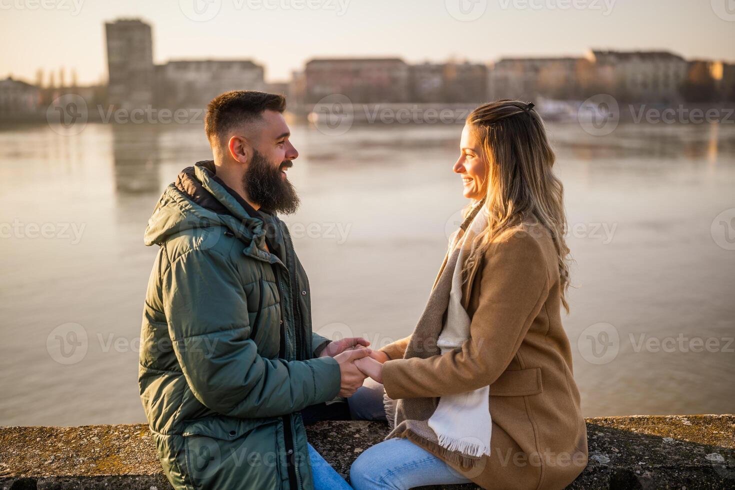 Happy couple holding hands while enjoy spending time together outdoor. photo