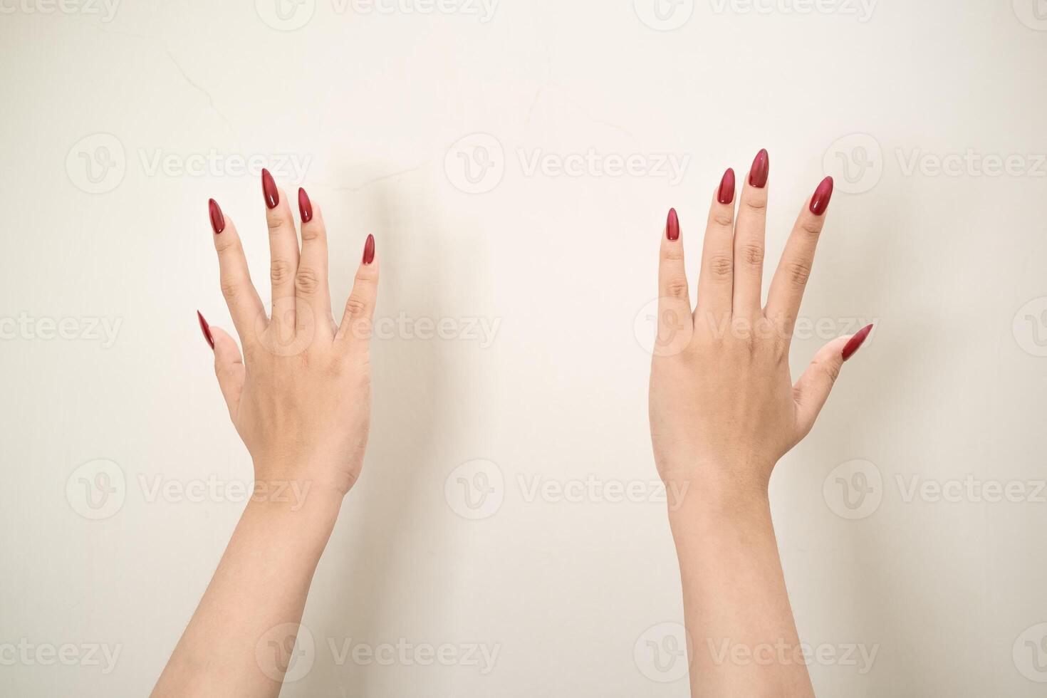 Hand use nails art pointing at something and make a sign on white background photo