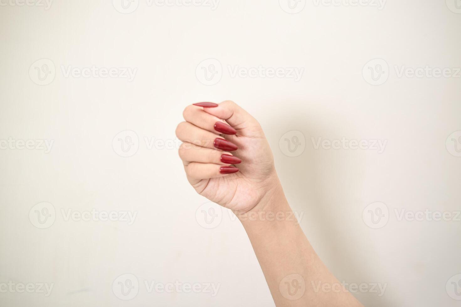 Hand use nails art pointing at something and make a sign on white background photo