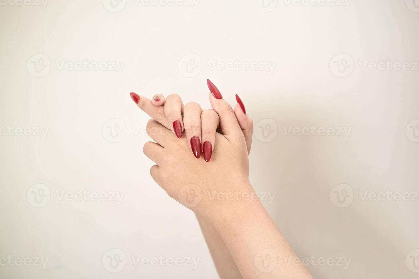 Hand use nails art pointing at something and make a sign on white background photo