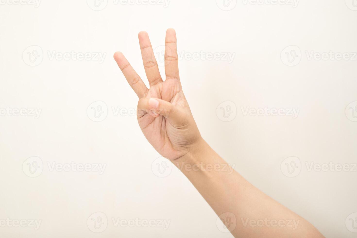 Hand pointing at something and make a sign on white background photo