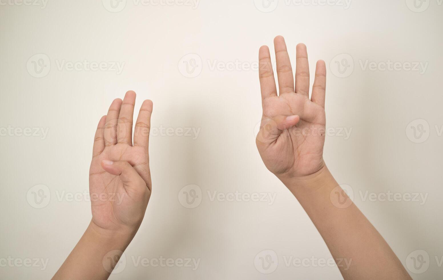 Hand pointing at something and make a sign on white background photo