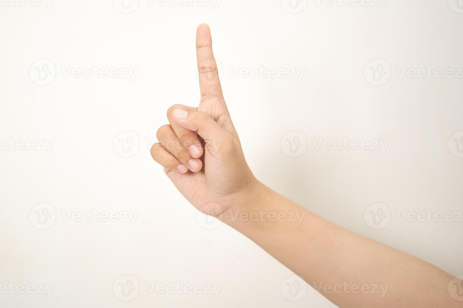 Hand pointing at something on white background photo