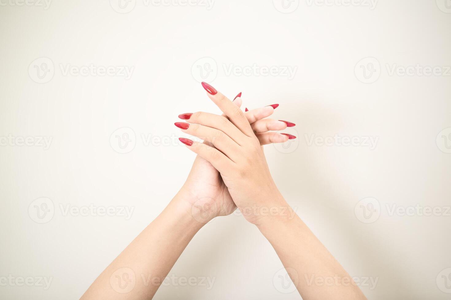 Hand use nails art pointing at something and make a sign on white background photo