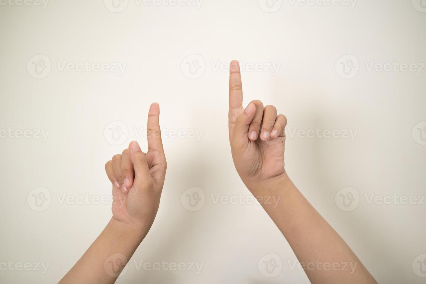 Hand pointing at something and make a sign on white background photo