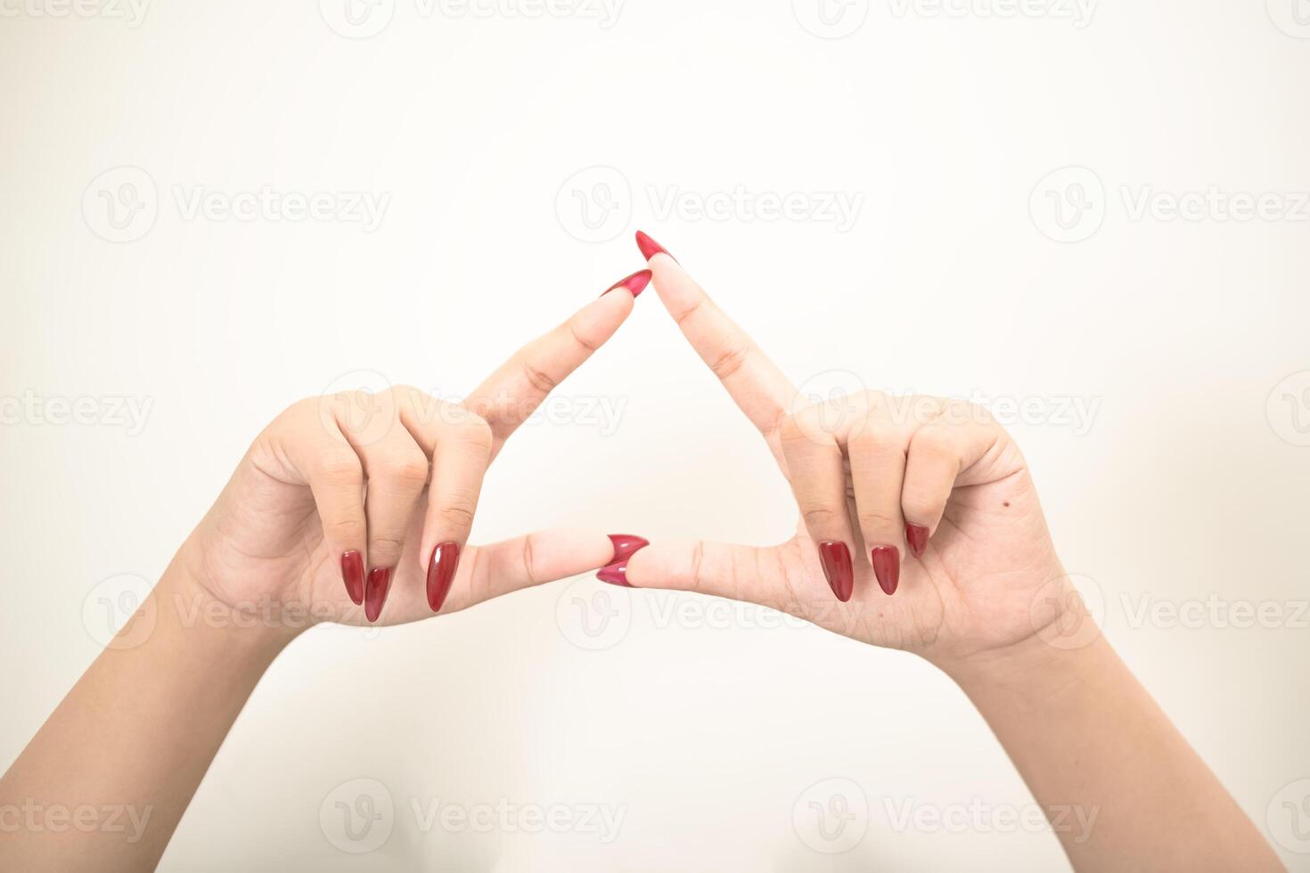 Hand use nails art pointing at something and make a sign on white background photo