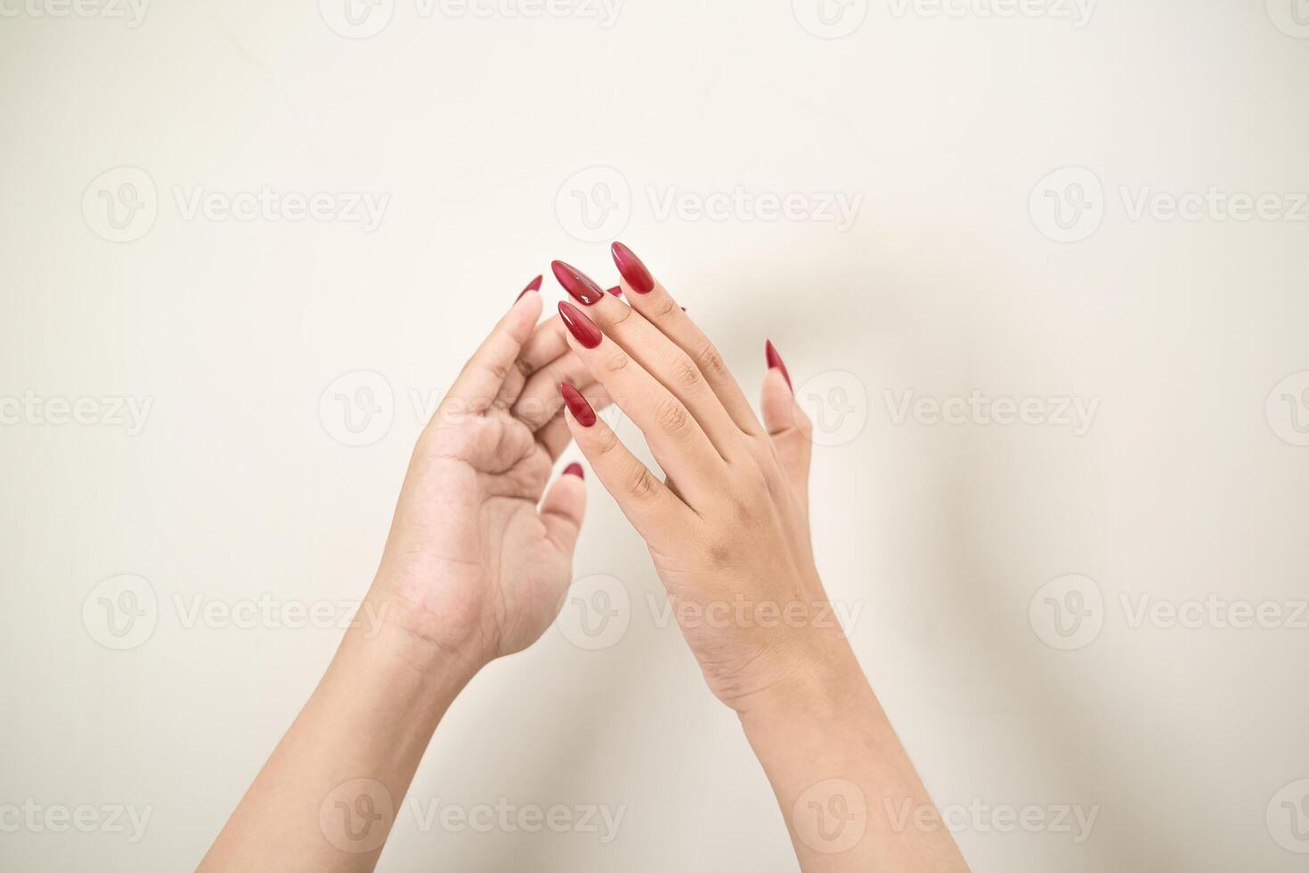 Hand use nails art pointing at something and make a sign on white background photo