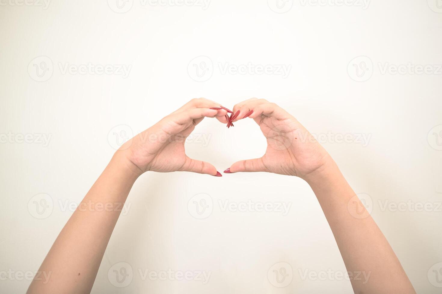 Hand use nails art pointing at something and make a sign on white background photo