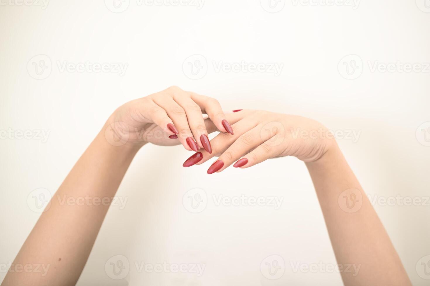 Hand use nails art pointing at something and make a sign on white background photo