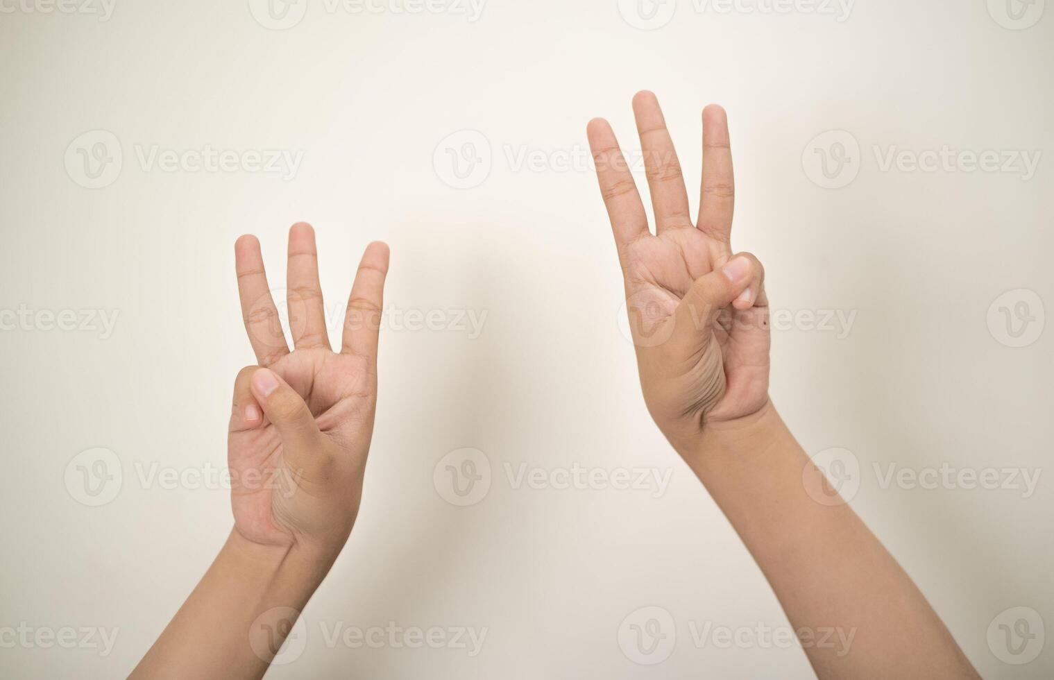 Hand pointing at something and make a sign on white background photo