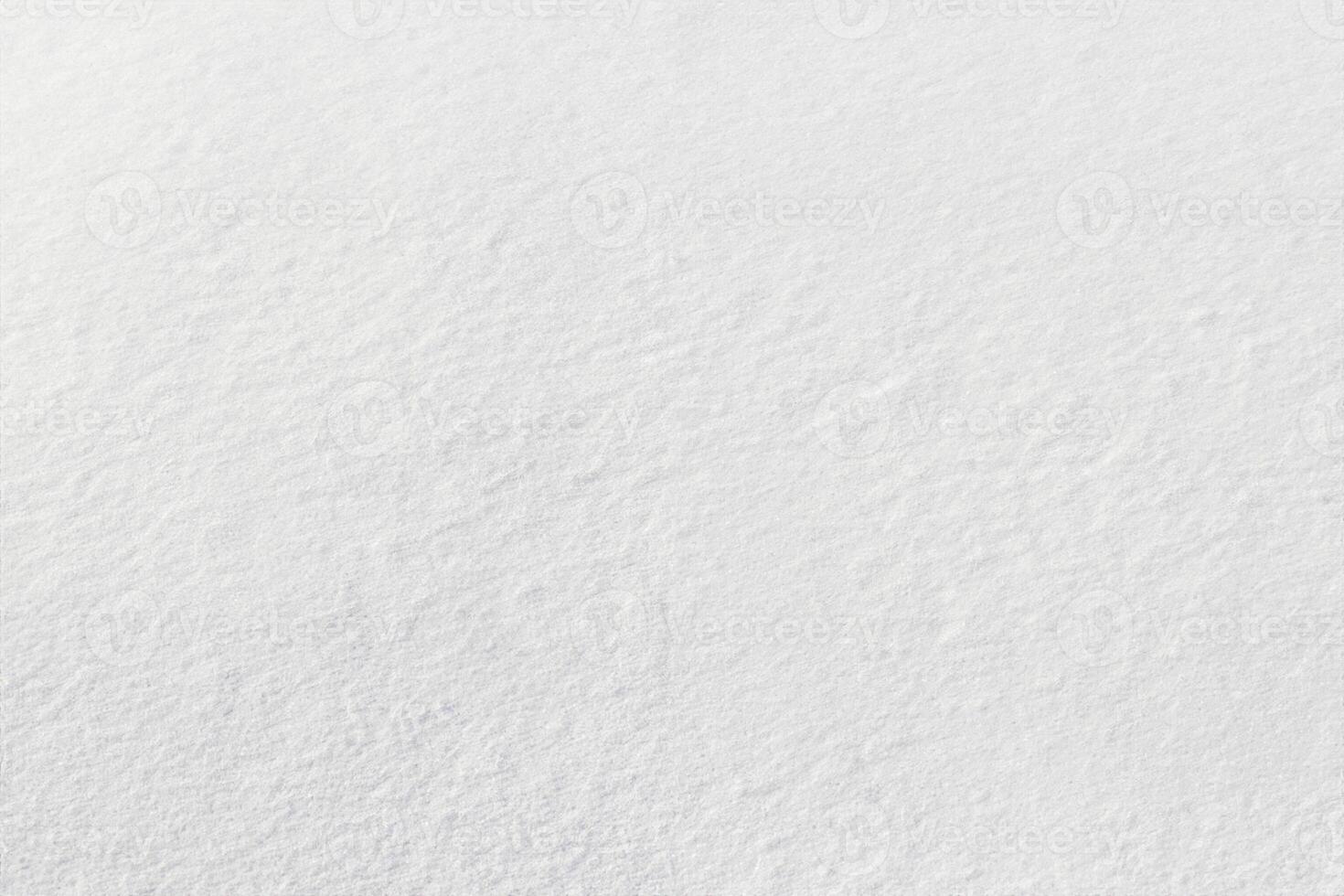 Uniform snow cover. Snow texture on a flat plot of land photo