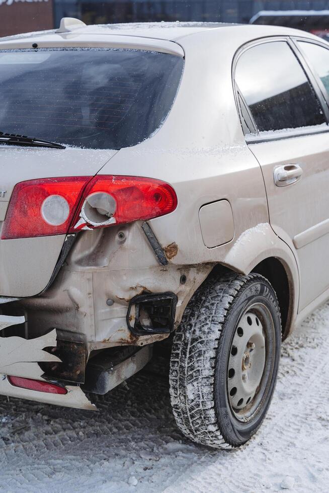 The rear bumper cracked, the wing of the car fell off, the car after the accident missing the rear part. photo