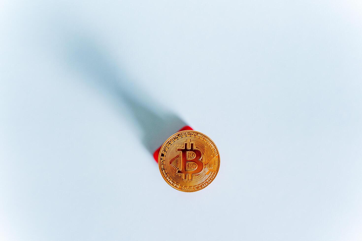 Cryptocurrency bitcoin. new money of the modern world. How to invest and earn. Bitcoin coin on a blue background.monetary transaction. Mine Ethereum and Bitcoin photo