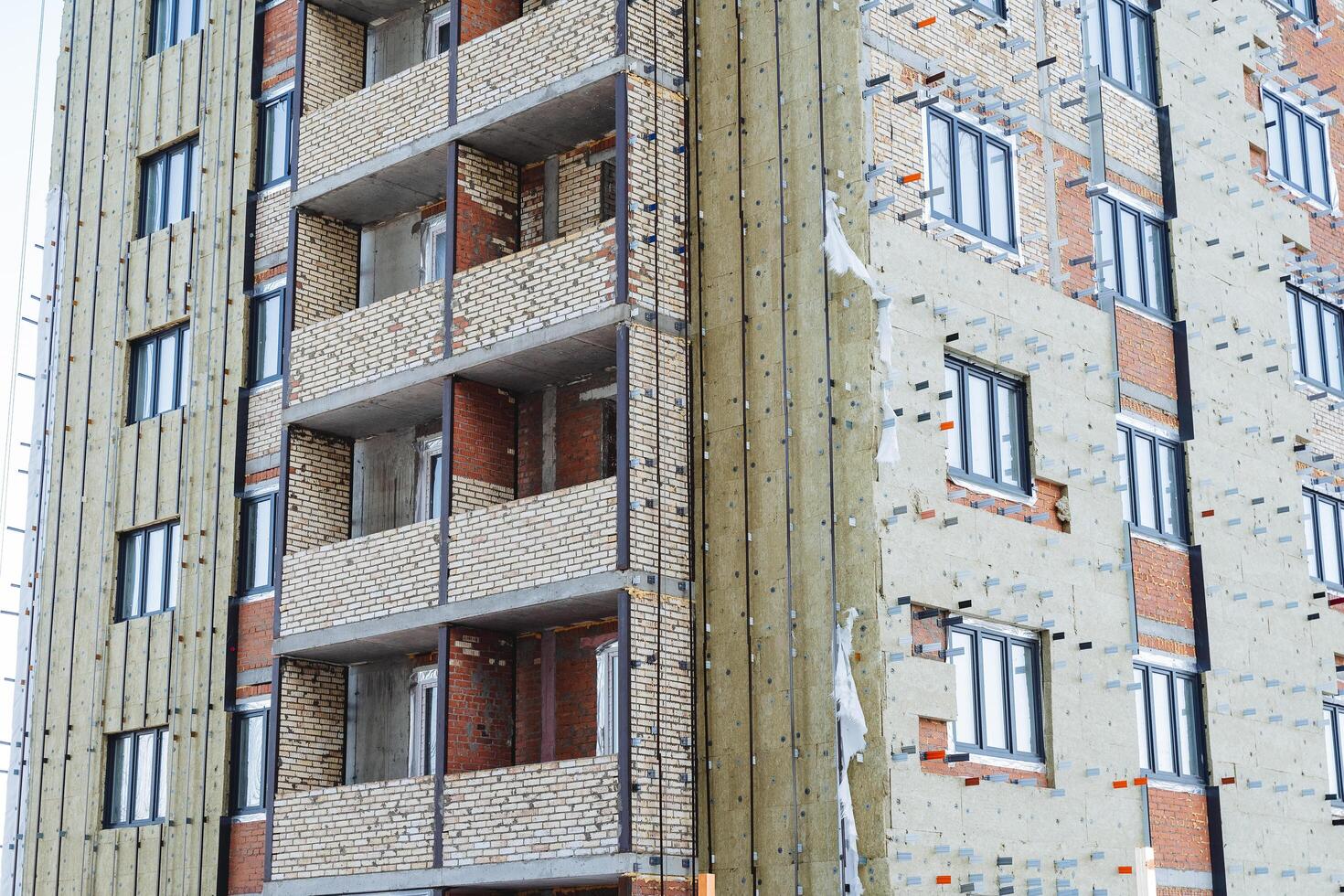 Home renovation, mineral wool insulation close-up. Protection of the building from the cold, thermal insulation, construction work. photo