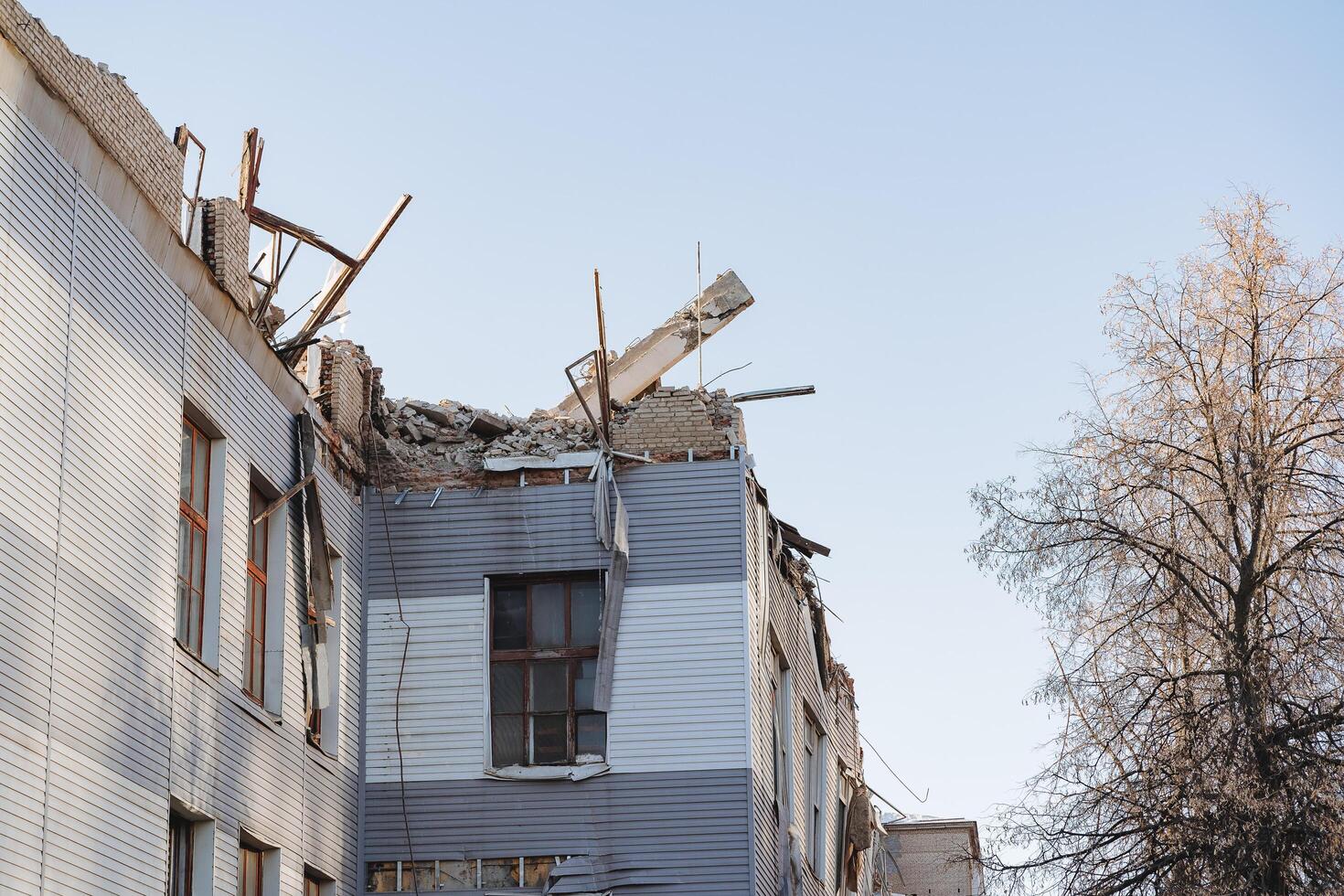 The remains of a broken building, the demolition of a construction site, the destruction of the old city. There is no roof of the house. photo