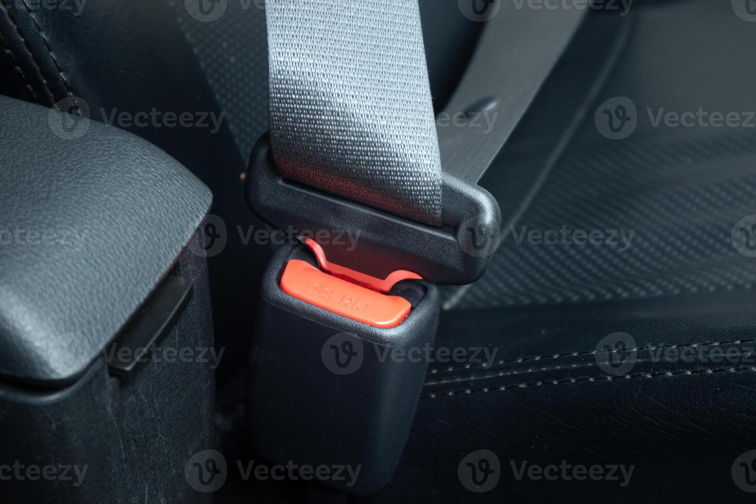 Safety belt installed in the car. Fastened seat belt photo