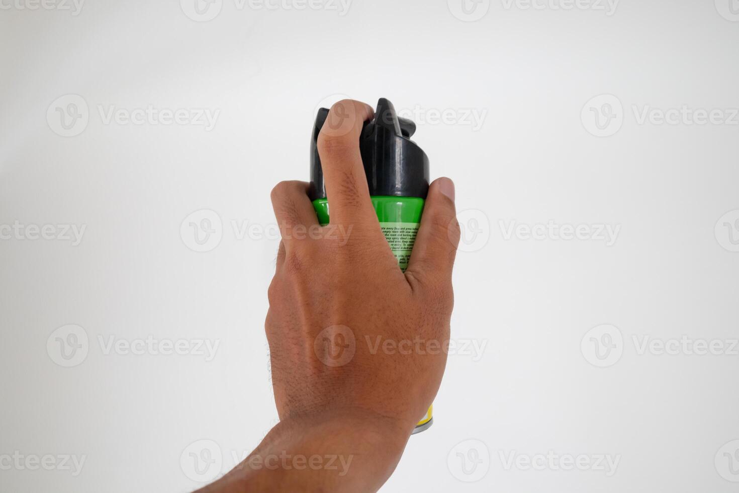 Hand holding an aerosol can of insecticide. Mosquito or insect spray with white background. photo