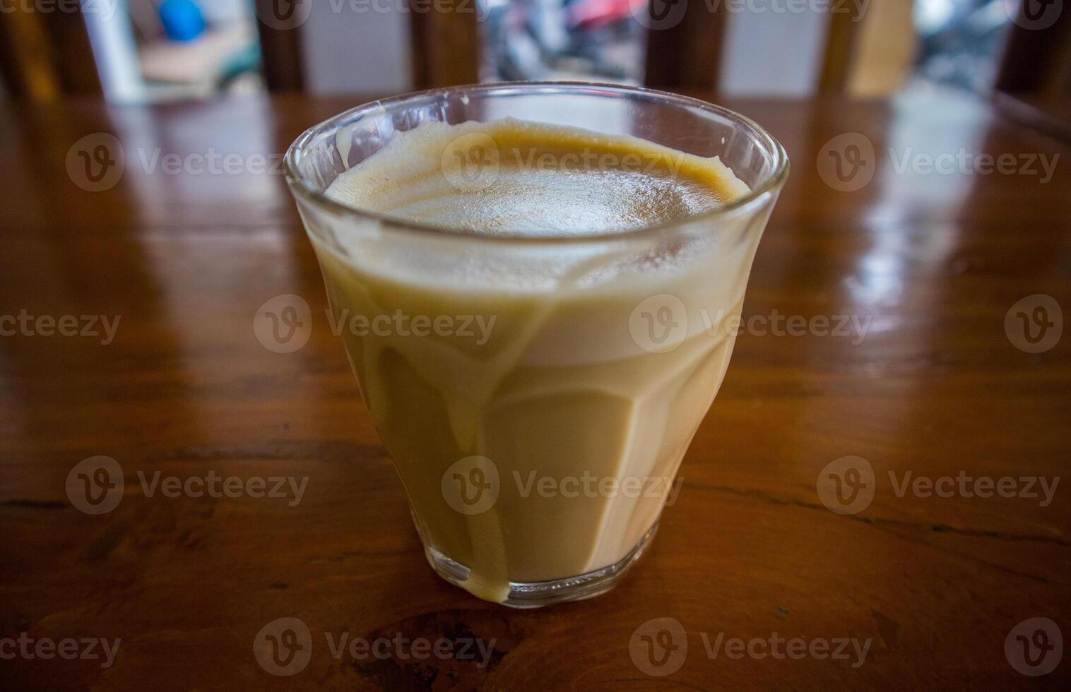 hot latte with latte art in wooden background photo