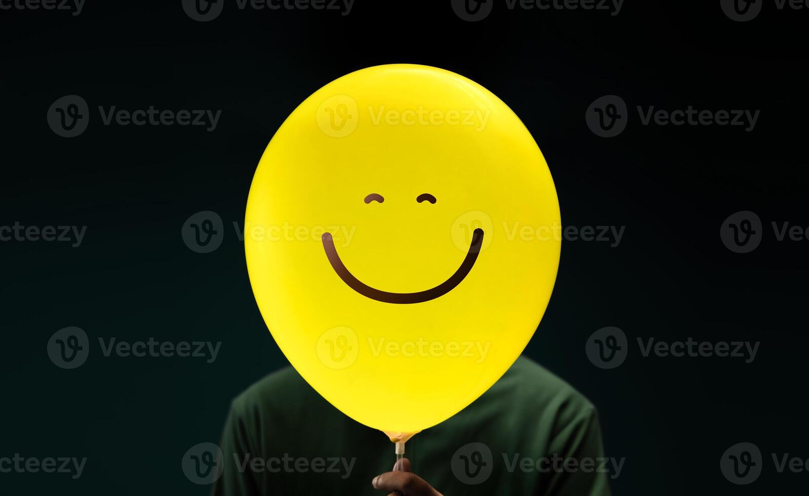 Happiness Day Concept. Happy and Optimistic Mind, Well Mental Health. Enjoying Life Everyday. Happiness Person with a Smiling Emoticon Balloon photo