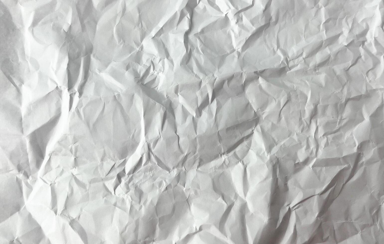 Crumpled wrinkled paper texture full page isolated on horizontal ratio background with empty blank copy space. photo