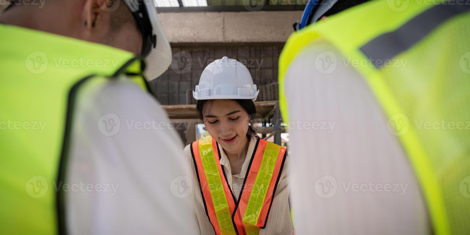 Construction concept of Engineer or architect meeting for project working with partner and engineering tools on building and blueprint in working site photo