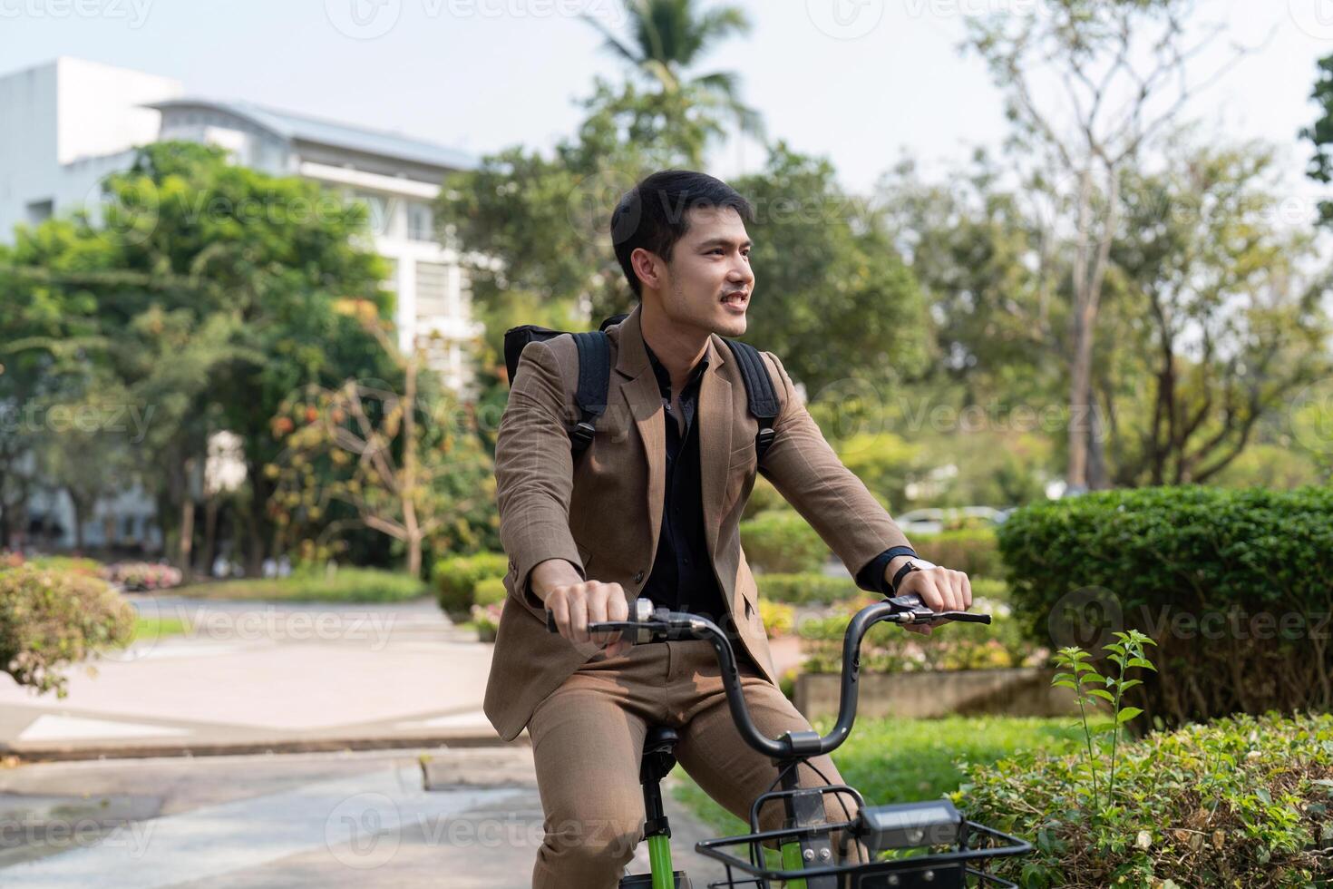 The businessman eco friendly transportation, cycling through the city avenues to go to work. sustainable lifestyle concept photo
