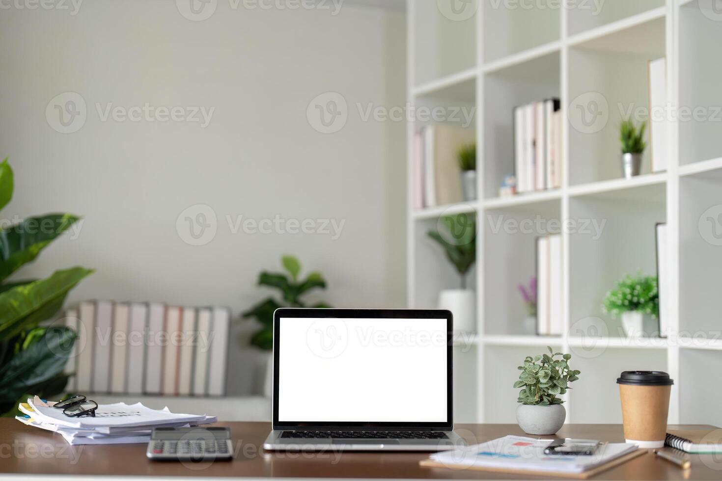 Mock up blank white screen laptop, book and home decor. Sustainability eco friendly lifestyle photo