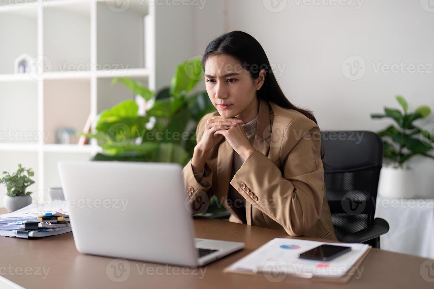 Eco friendly, businesswoman young asian stress in working on laptop while sitting at home office, green room area. sustainable lifestyle concept photo