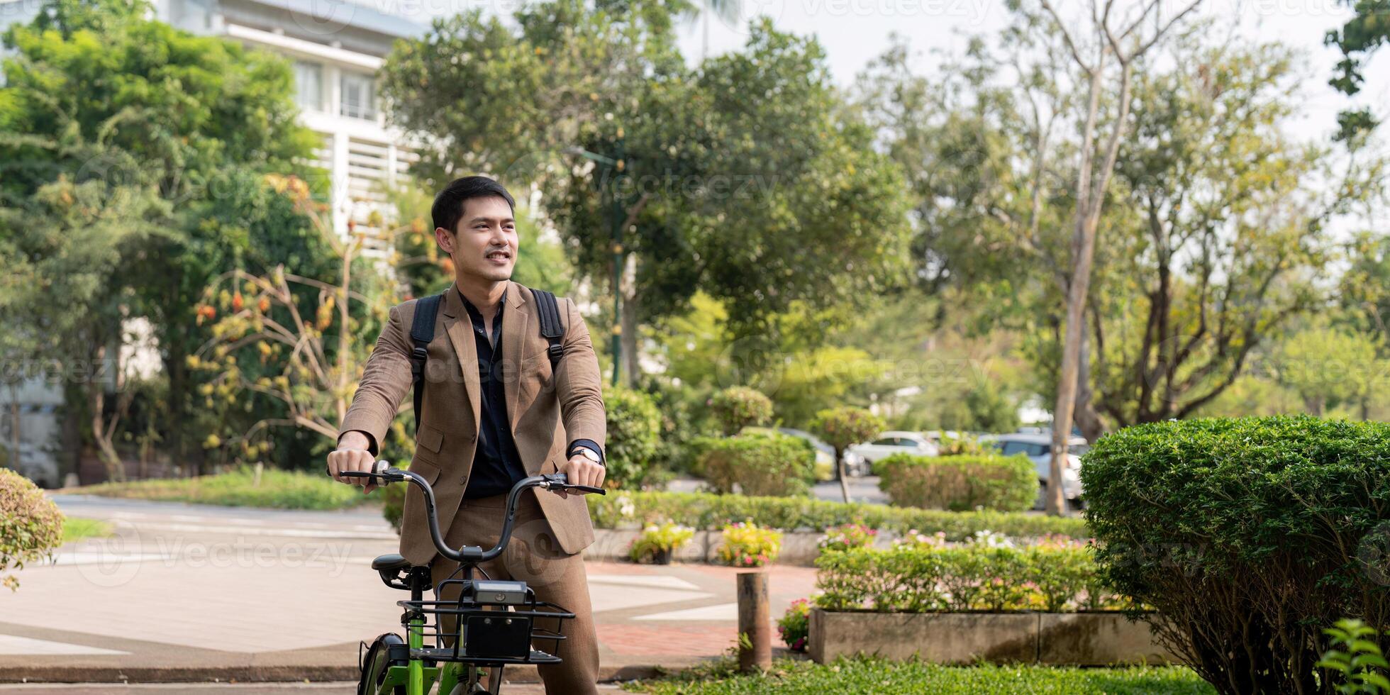 The businessman eco friendly transportation, cycling through the city avenues to go to work. sustainable lifestyle concept photo