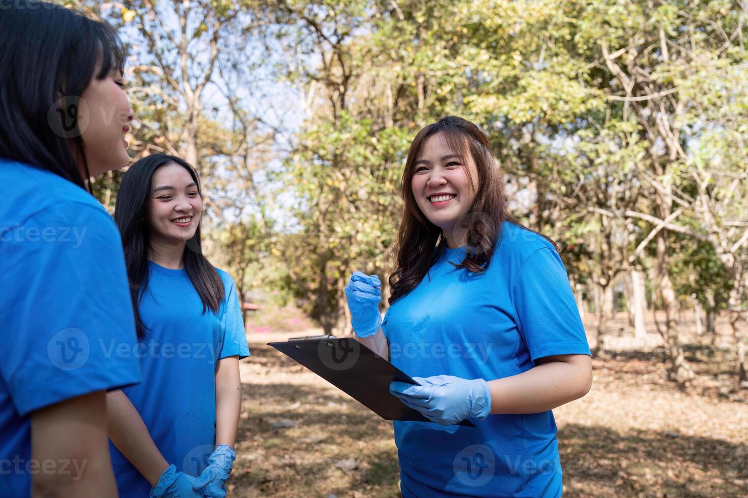 Volunteer collecting plastic trash in the forest. The concept of environmental conservation. Global environmental pollution. Cleaning the forest photo