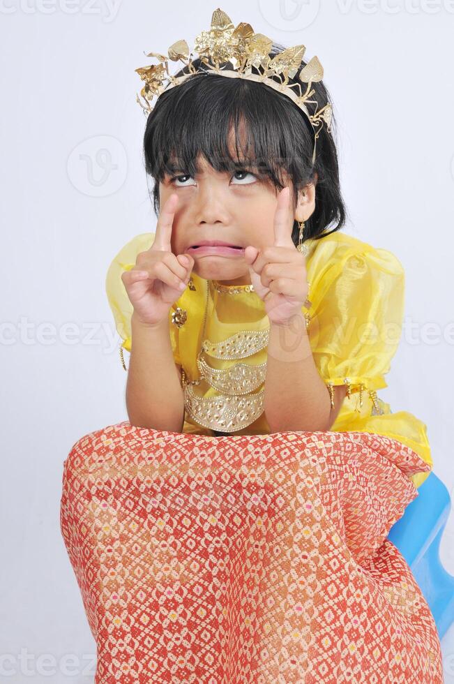 a 10 year old Indonesian girl wearing traditional clothes from Palembang photo