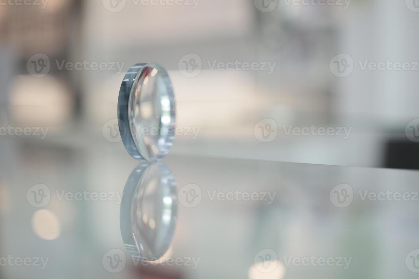 Glasses lenses on the table in optic, eyeglasses lenses photo