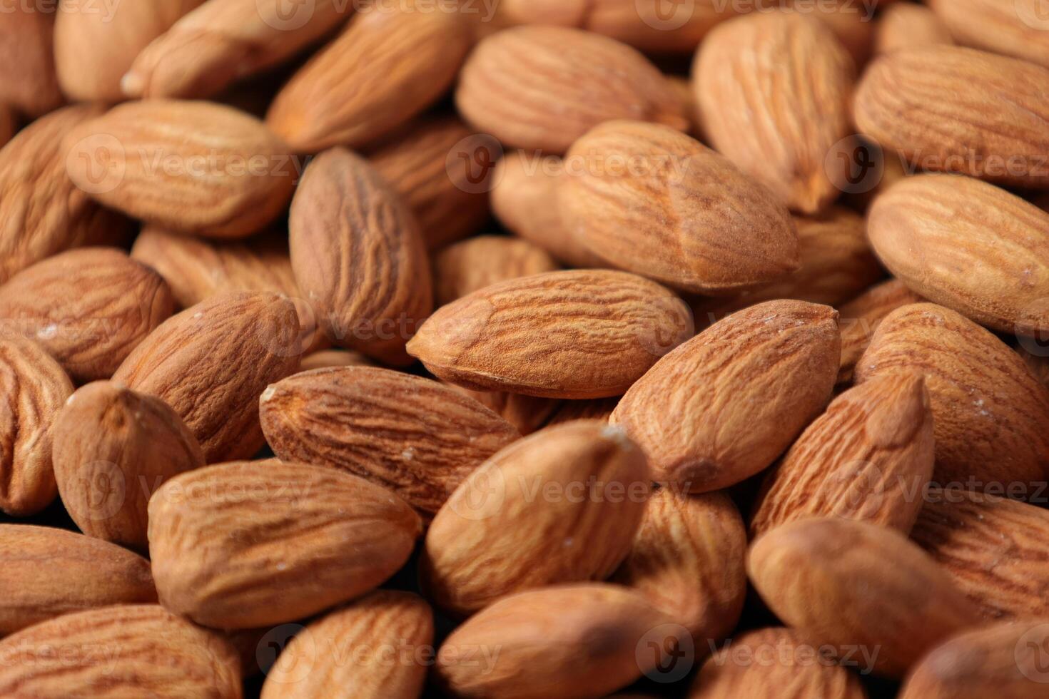 Closeup of almond, nut food, brown almonds photo