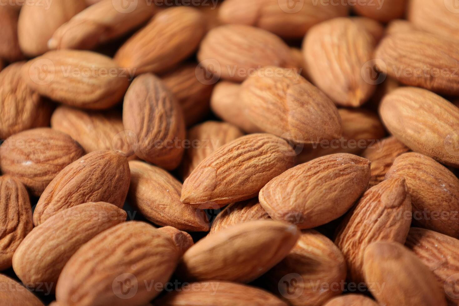 Closeup of almond, nut food, brown almonds photo