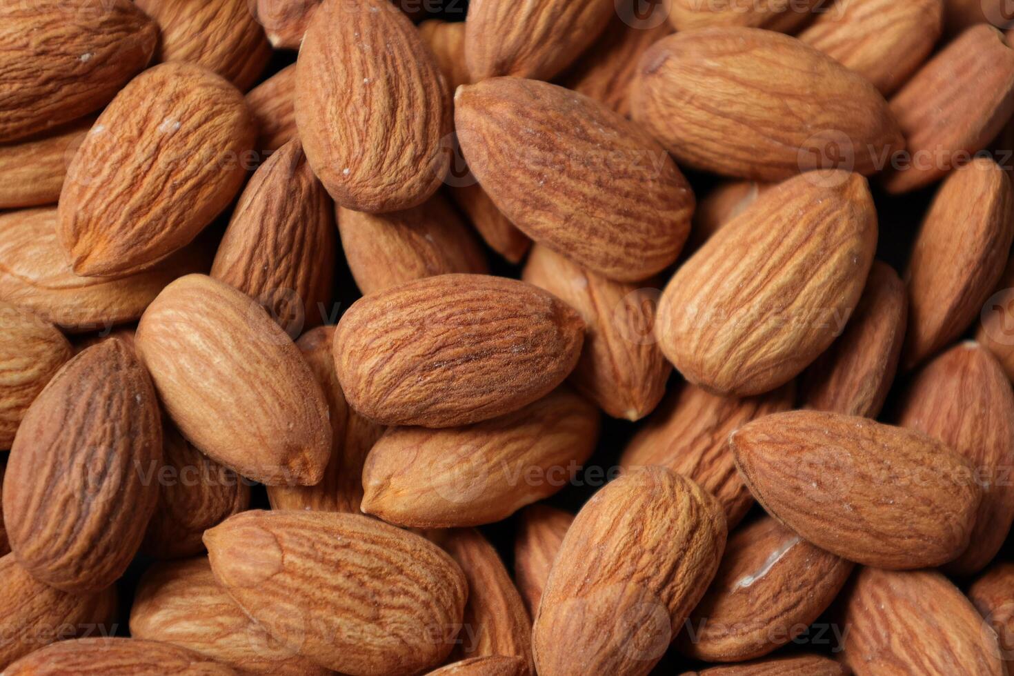 Closeup of almond, nut food, brown almonds photo