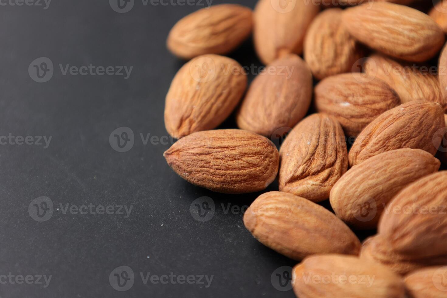 Closeup of almond, nut food, brown almonds photo
