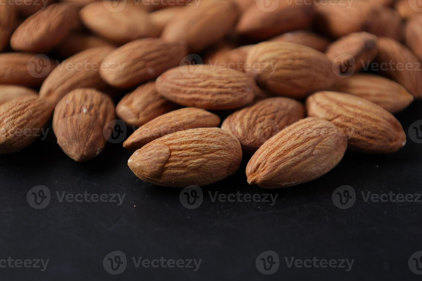 Closeup of almond, nut food, brown almonds photo